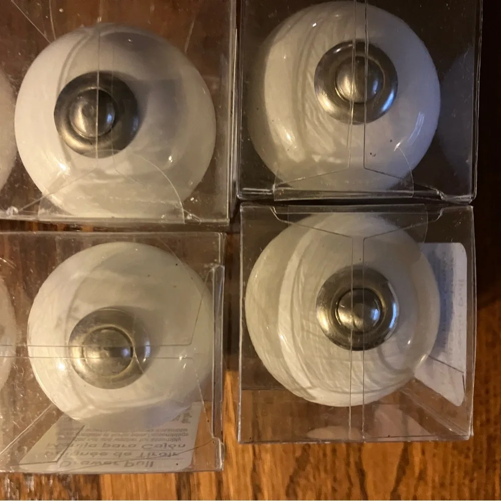 Set of 4 White Ceramic Drawer Knobs never used, still unopened.
